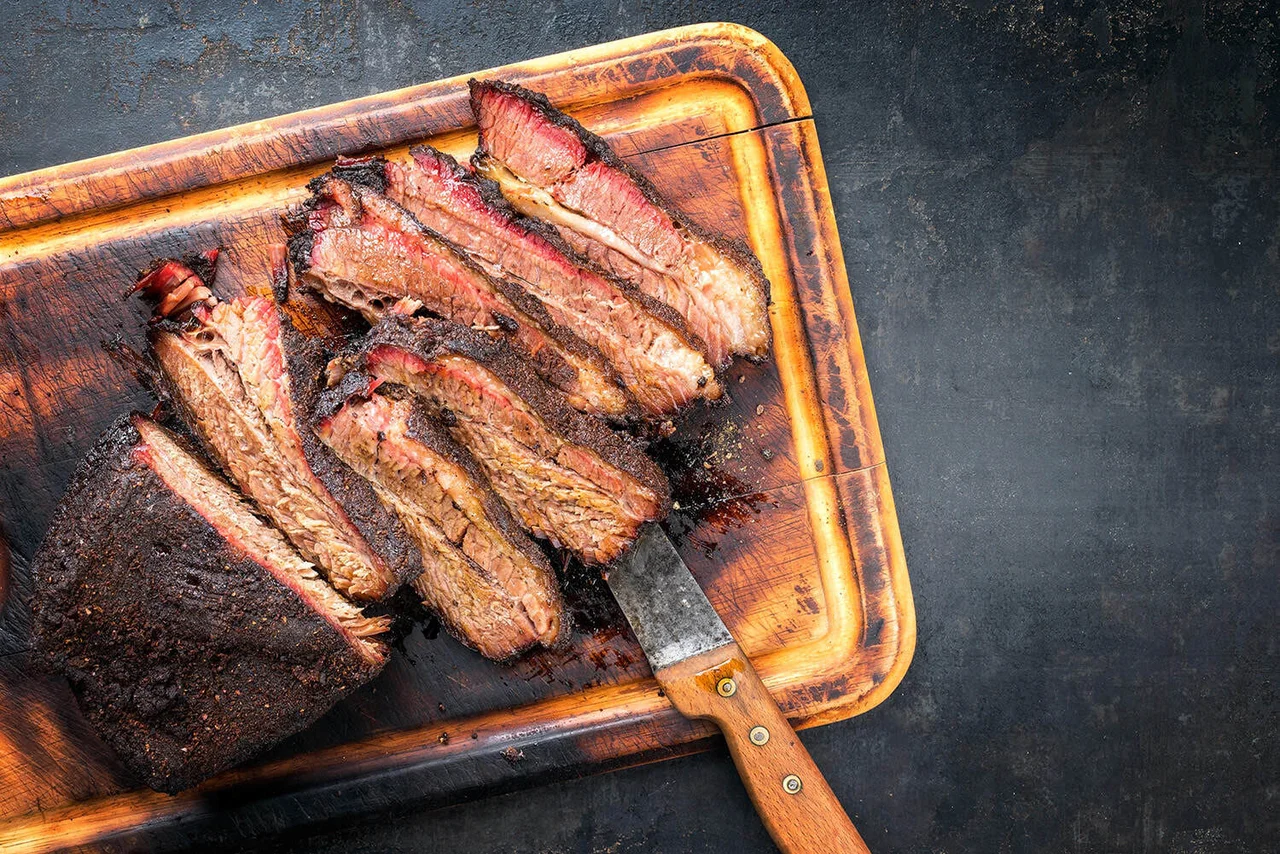 A Raw Meat Piece on a Cutting Board.